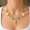 Coastal Chic Beach Necklace – Gold-Tone Chain with Sea Shell, Pearl, and Fish Charm Detail